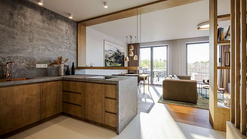 Vnitřní uspořádání klade důraz na prostorný obývací pokoj propojený s kuchyní, kde se má odehrávat veškerý denní ruch.
