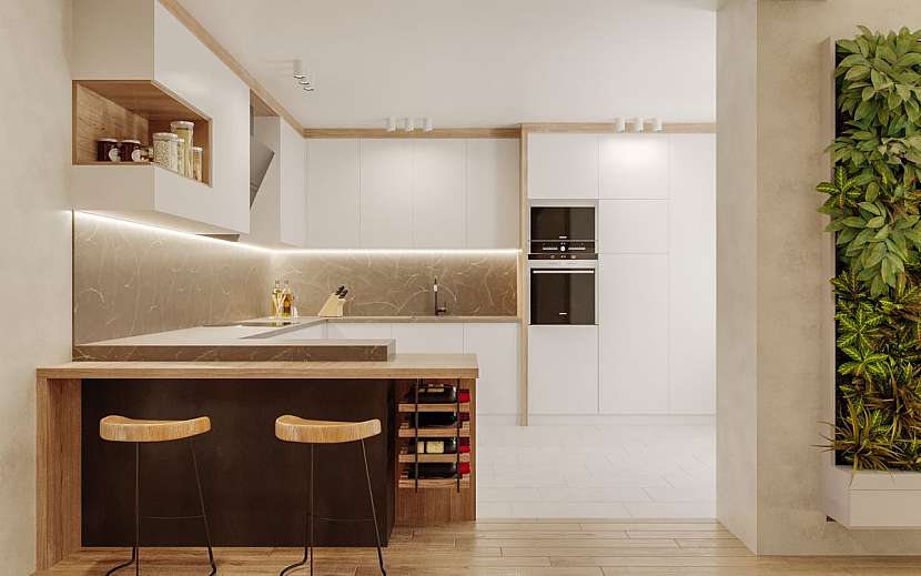 Bílou kuchyň oživí dřevo a živá zelená zeď.