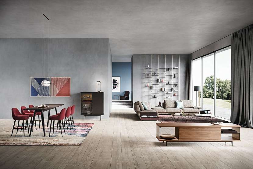 Poměrně typický interiér současnosti s novým stolem Deen. O barvy se tu stará koberec, obrazy, židle, vzadu vykukuje stěna. Walter Knoll.