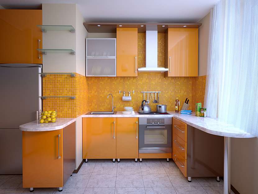 Jemný odstín oranžové kuchyně zkuste vylepšit modrou nebo zelenou barvou doplňků